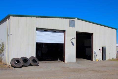 ACME Precision Diesel shop at 200 Shortie Street in Greer, bay doors open with truck tires stacked out front
